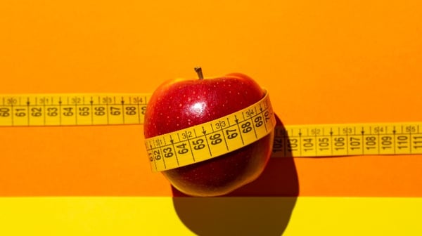 Image showing a picture of a measuring tape and apple - depicting BMI